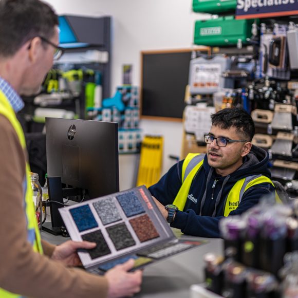 Customer looking at colour swatch options with Headlam team member
